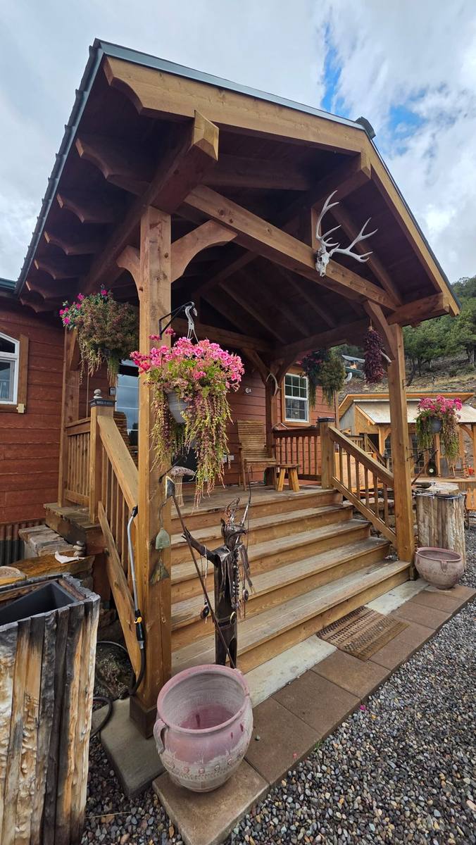 Timber entry porch with curved knee braces