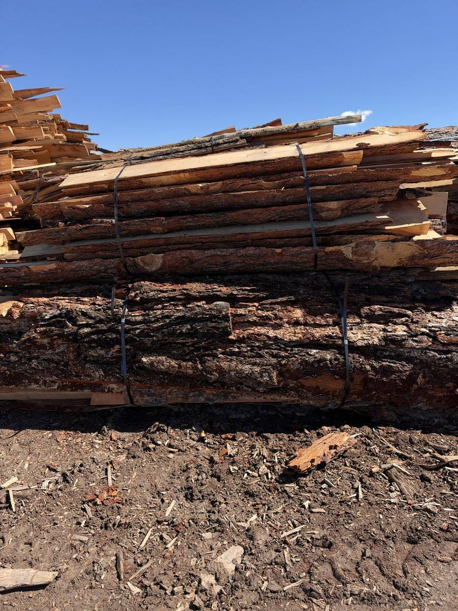 Strapped bundle of slab wood at the yard