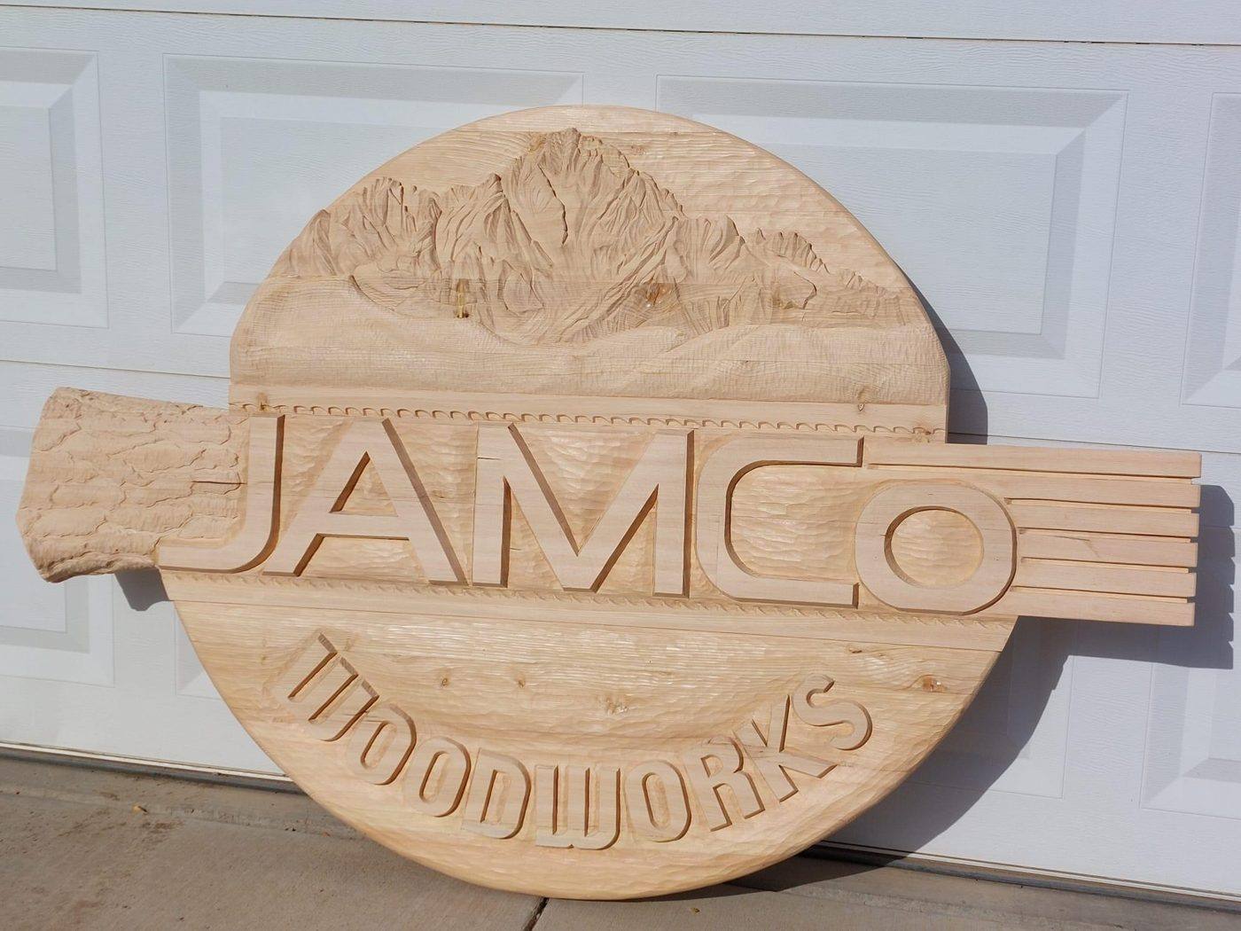 The carved JAMCo sign before painting